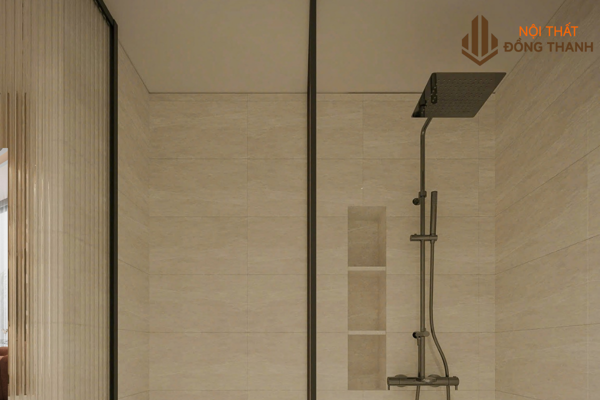 Phòng tắm với vòi sen đứng, lát gạch men cùng tone màu